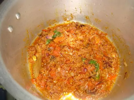 adding turmeric poweder in veg biryani recipe