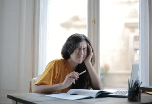 A girl having difficulty studying.