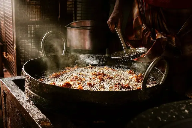 man cooking Indian food