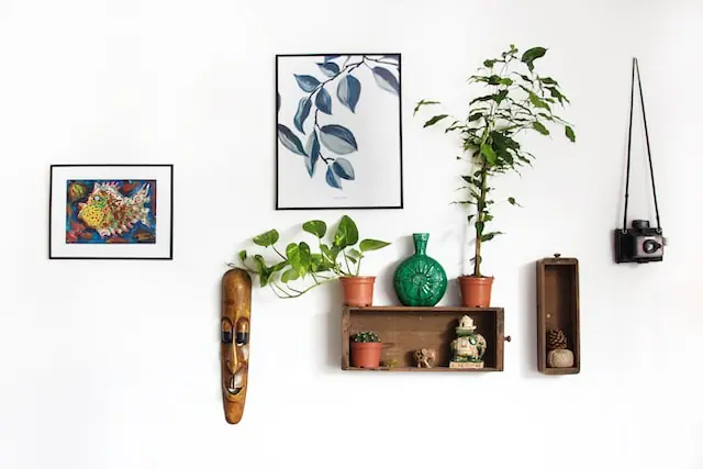 A wall with painting and decorations used for personalizing your space