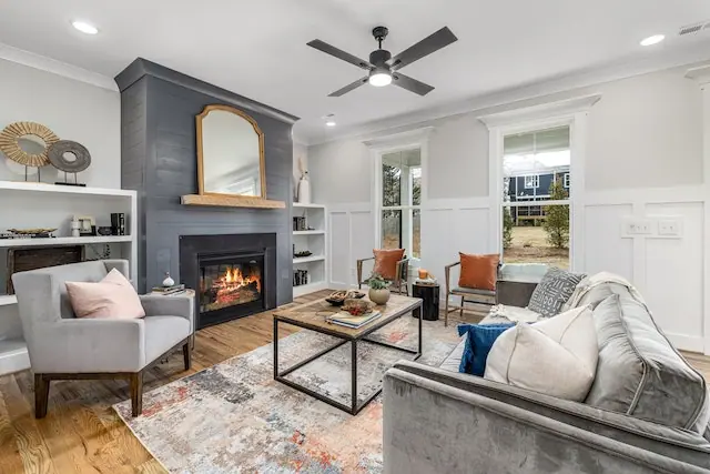 modern living room interior with light gray furniture and a fireplace