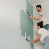 couple painting and choosing the right color for every room