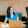 Consulting candidates participating in a structured interview meeting in a modern office